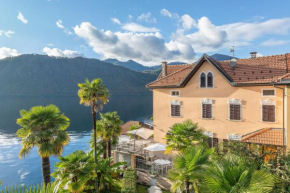 Casa delle Palme con terrazza sul lago e spiaggia